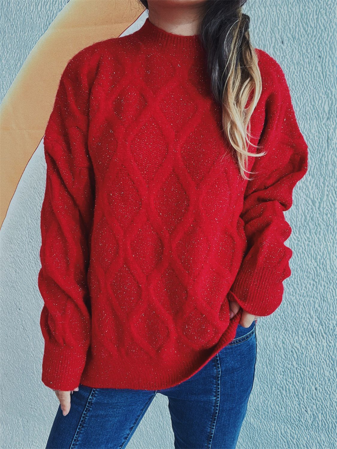 Red sparkle knit relaxed fit sweater with diamond pattern and mock neck.