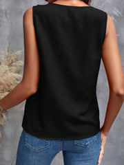 Black sleeveless blouse with cascading ruffles, casual style