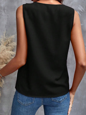 Black sleeveless blouse with cascading ruffles, casual style