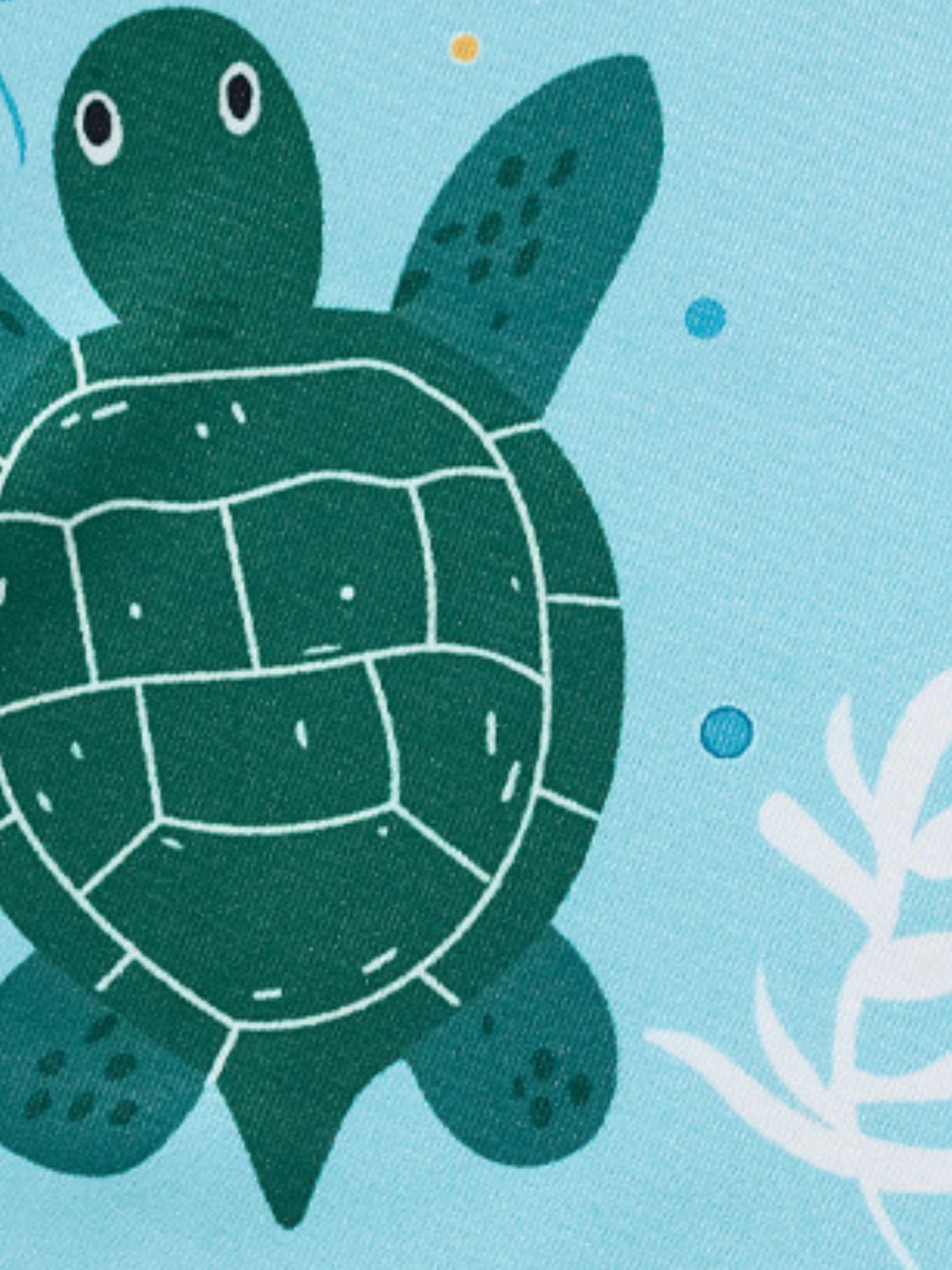 Toddler tee and shorts set with a green sea turtle print on light blue fabric.