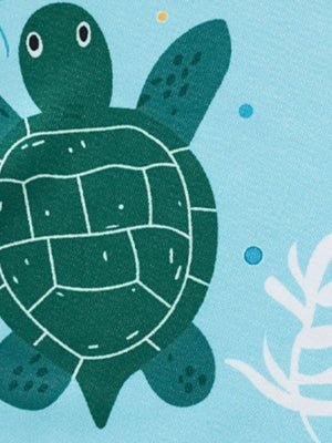 Toddler tee and shorts set with a green sea turtle print on light blue fabric.