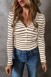 Ribbed stripe henley top in cream and brown with button placket and V-neck.