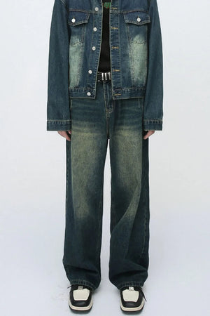 Relaxed fit dark wash denim jeans with a faded, distressed look.