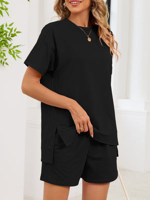 Black relaxed two-piece set with crew neck tee and pocketed shorts.