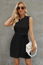 Black belted knit tank dress with A-line skirt and crew neck.