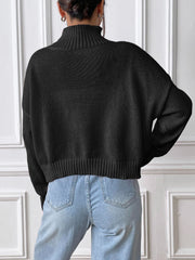 Black cropped turtleneck knit sweater with ribbed hem and cuffs.