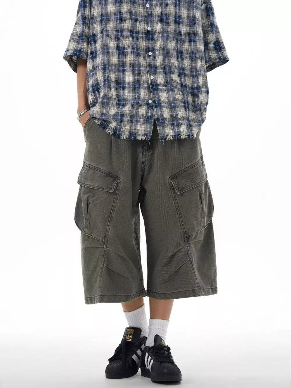 Relaxed cargo capris in grey with multiple pockets and a loose fit.