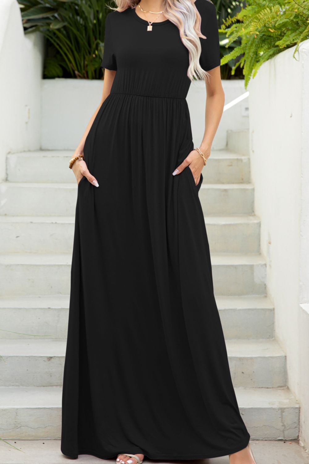 Black gathered waist maxi dress with short sleeves and pockets