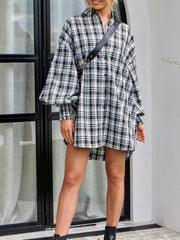 Overshirt in black and white plaid with balloon sleeves and a collared neckline.