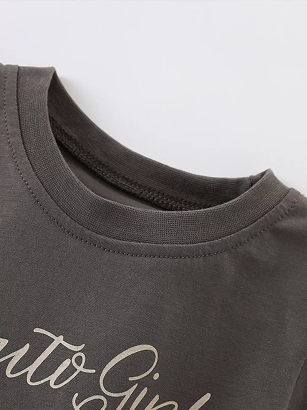 Toddler crew neck t-shirt in charcoal gray cotton with a playful script graphic.