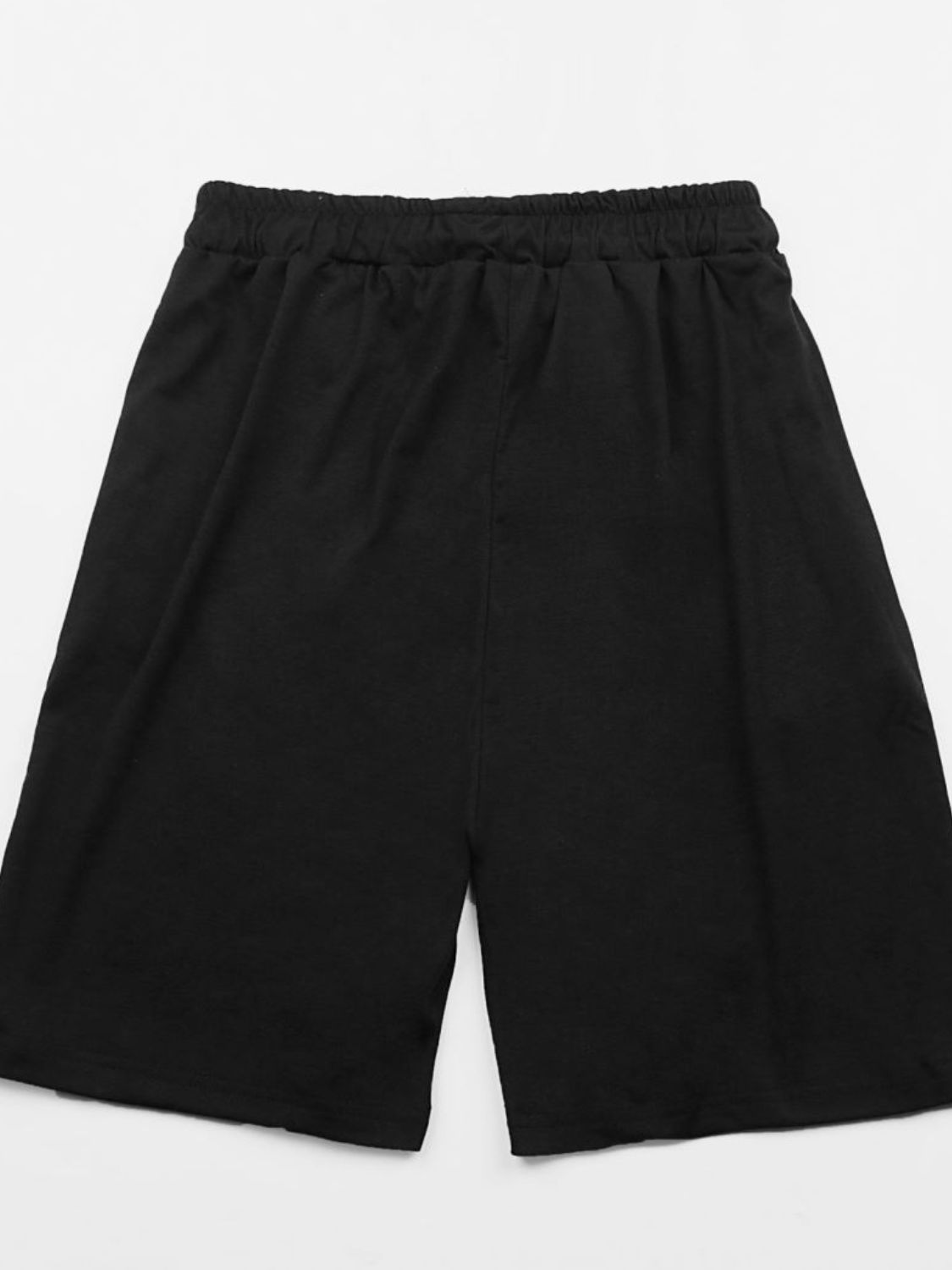 Black relaxed fit jogger shorts with elastic waistband and graphic detail.