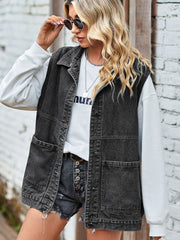 Black oversized denim utility vest with button front and four pockets.