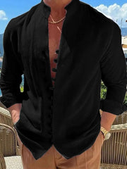 Black linen shirt with mandarin collar and button placket, long sleeves.