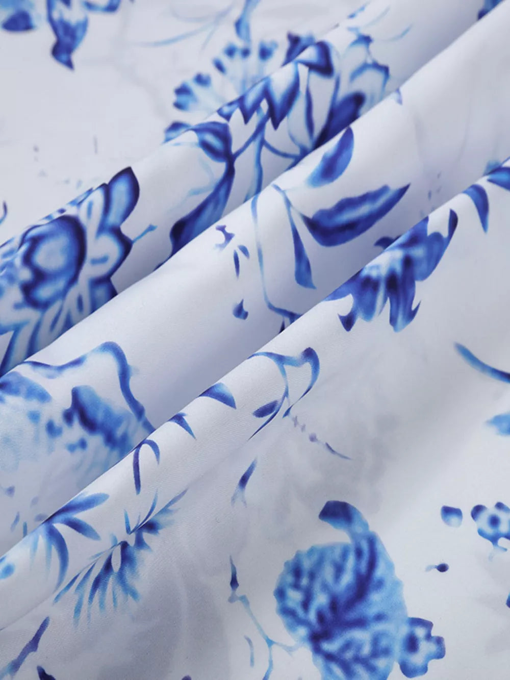 Men's Full Size Floral Print Button-down Shirt in Light Blue, close-up detail