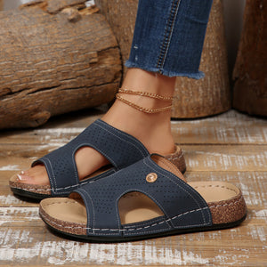 Blue perforated pu leather wedge sandals with open toe and cork sole.