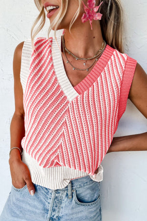 Chevron knit vest in coral and cream with V-neck and open knit details.