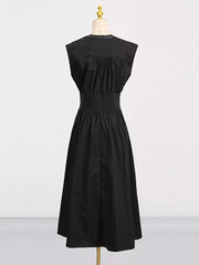 Black midi dress with elastic waistband, ruched bodice, and faux leather collar detail.