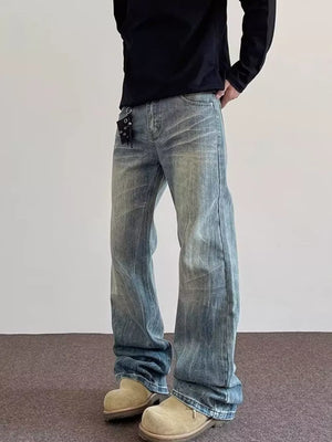 Men's vintage wash blue cotton wide leg jeans with a relaxed fit.
