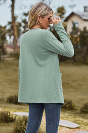 Sage textured open-front cardigan with pockets and long sleeves.