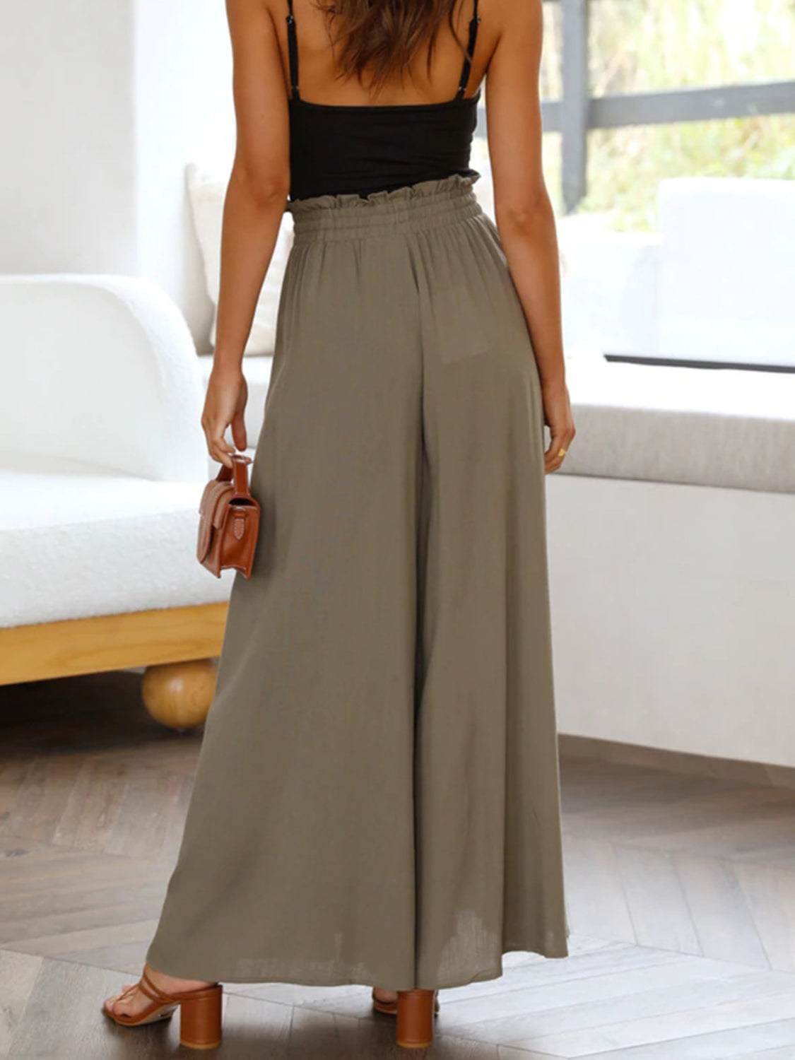 Textured olive brown drawstring palazzo trousers with a ruffled high waist.