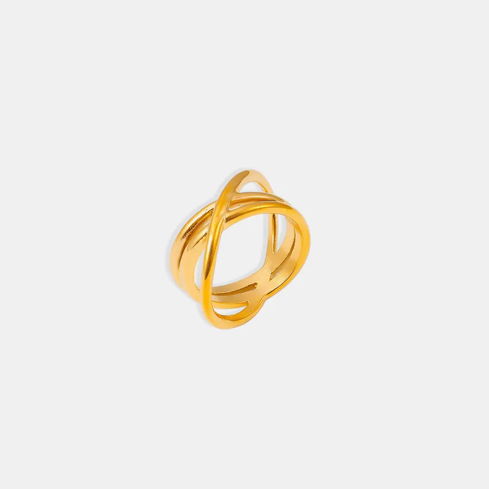 Gold intersecting band ring set with a modern, minimalist design.