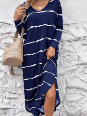 Navy abstract striped V-neck maxi dress with side slits and long sleeves.