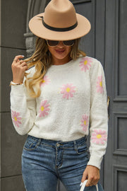 Ivory textured knit sweater with pink daisy motif, crew neck, long sleeves.
