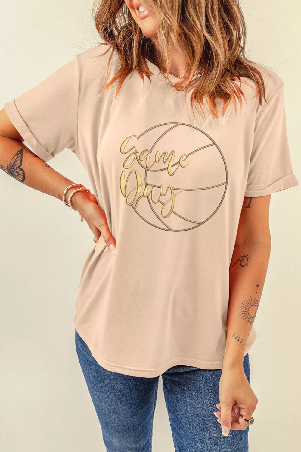 Beige cotton graphic t-shirt with basketball design and gold text.