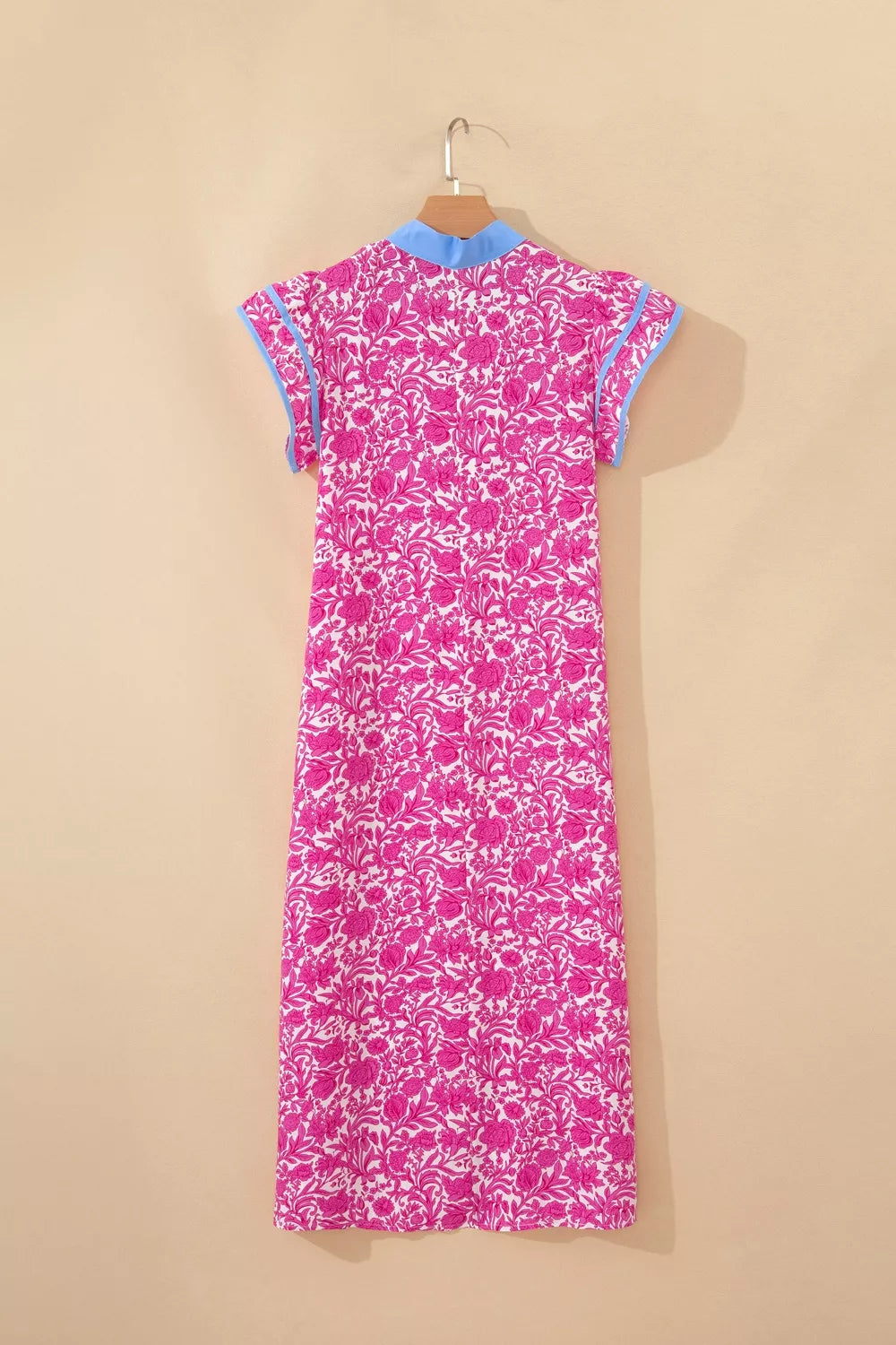 Vibrant floral midi dress with ruffle sleeves and blue collar.