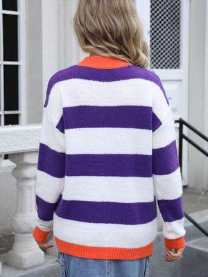 Acrylic knit sweater with purple and white stripes, orange collar and cuffs.