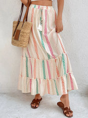 Chevron stripe tiered maxi skirt with drawstring waist and tassel detail in multicolor.