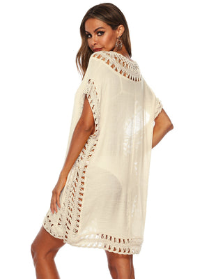 Cream crochet trimmed kaftan cover-up with short sleeves and open knit details.