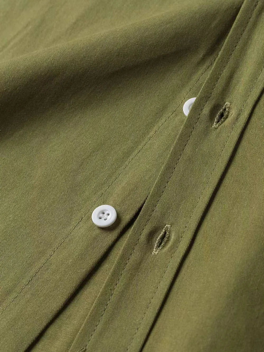 Olive green Oxford button-down shirt with white buttons and buttonholes.
