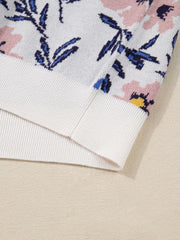 Patchwork sweater with floral design in floral color, featuring ribbed cuffs and hem.