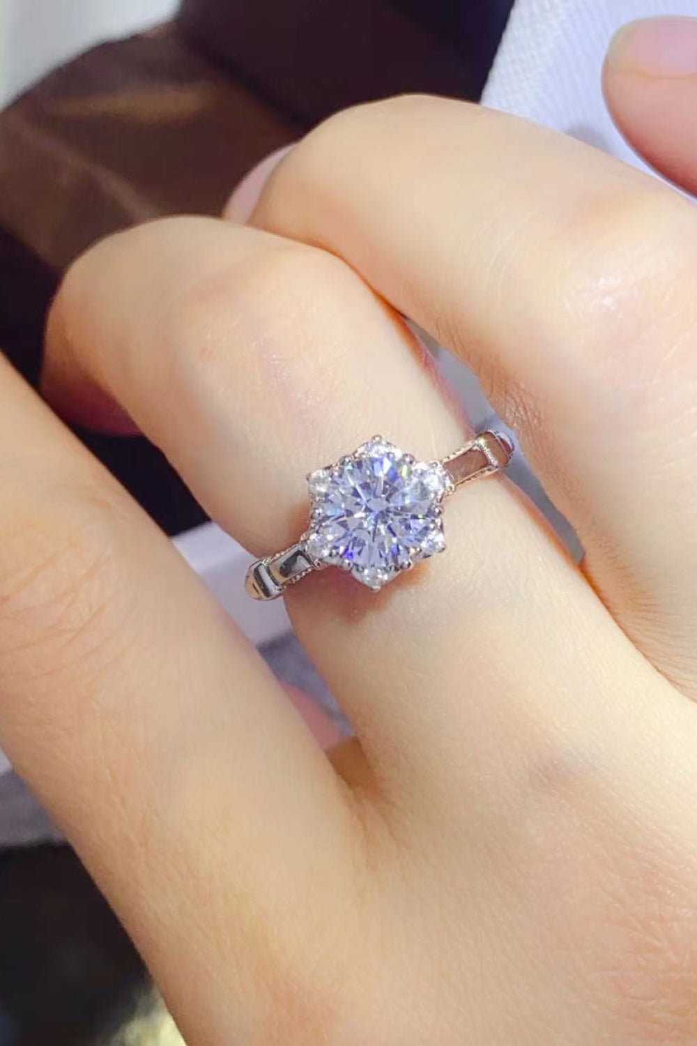 Emerald Bloom Moissanite Halo Ring in 925 sterling silver with a bright, sparkling center stone.