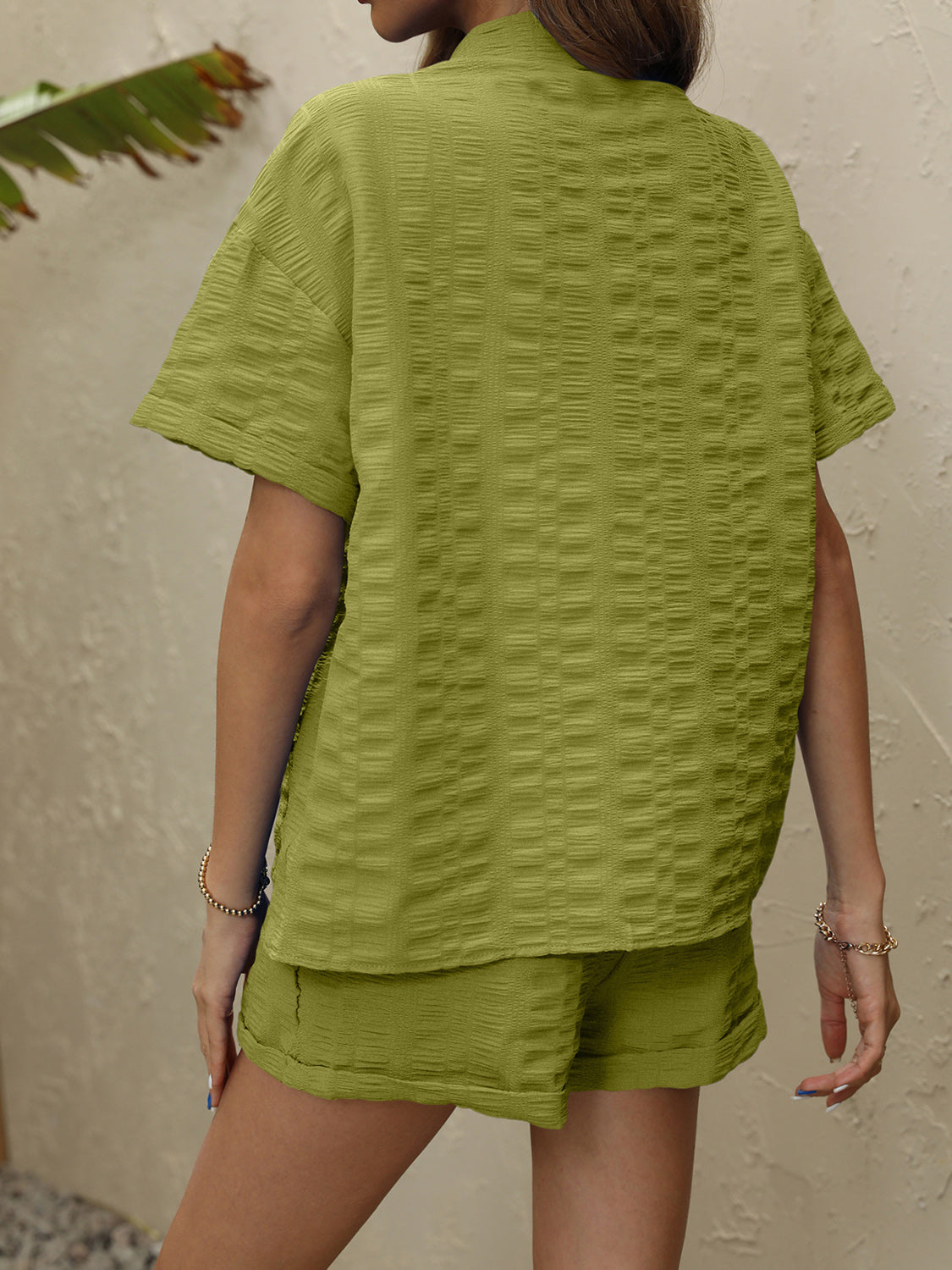 Lime textured resort shirt and shorts set with short sleeves and collared neckline.