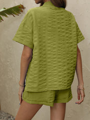 Lime textured resort shirt and shorts set with short sleeves and collared neckline.