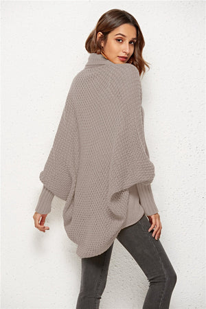 Textured cocoon knit cardigan in tan with batwing sleeves and a high neckline.