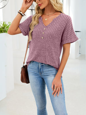 Ribbed knit short sleeve t-shirt in dusty blue with V-neck and decorative buttons.