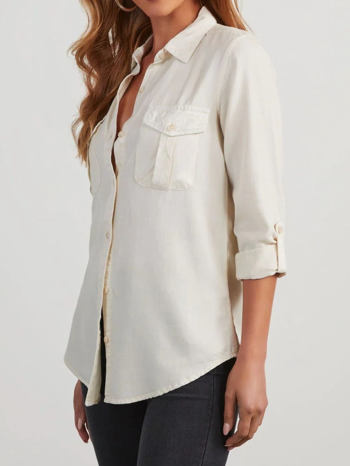 Washed denim utility shirt in white with button front and chest pockets.