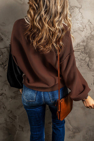 Chic Contrast Cozy Sweater in brown with black sleeves and balloon sleeves.