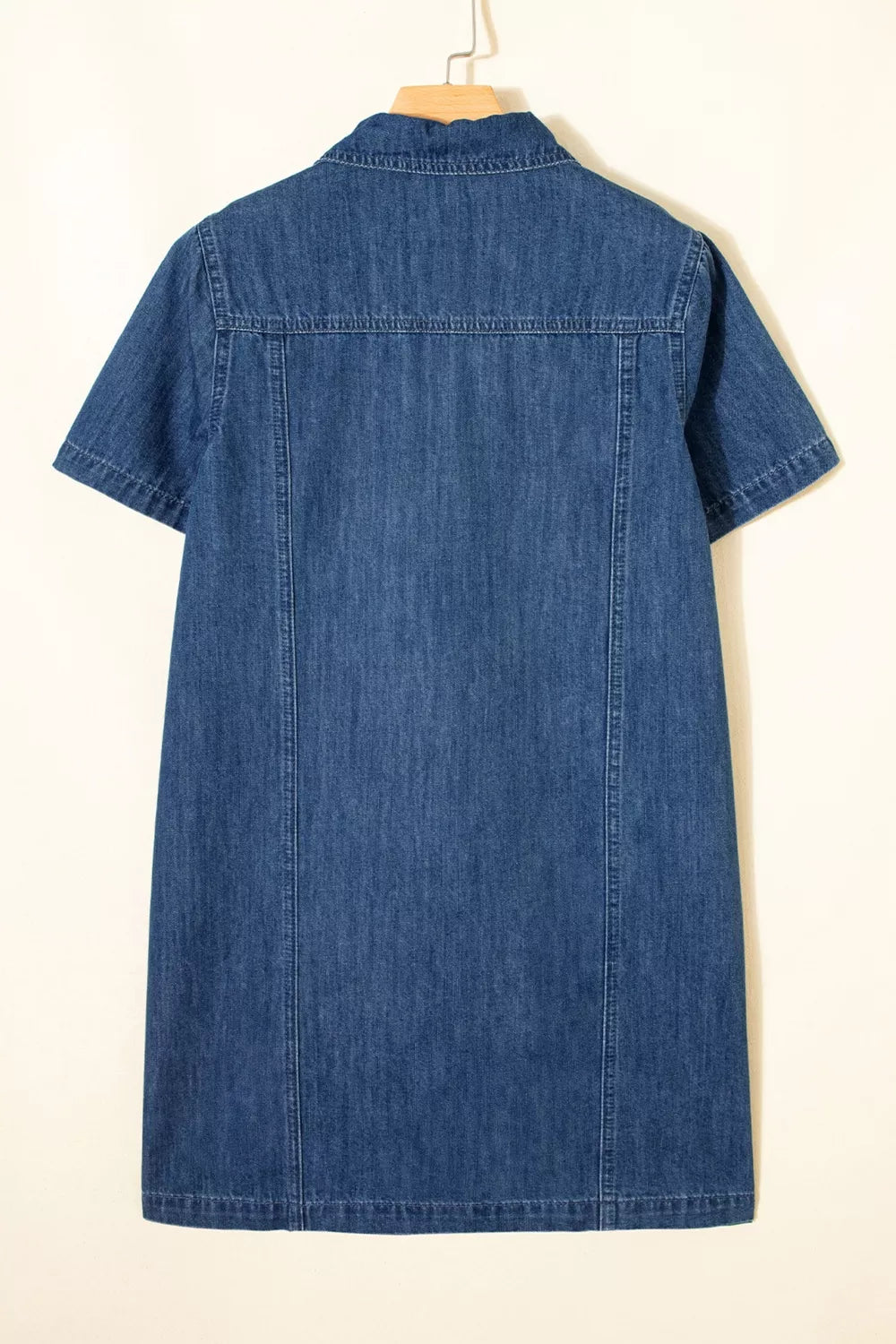 Dark blue denim mini dress with short sleeves and collar, back view.