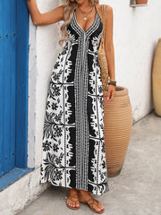 Maxi dress with halter neck, deep V, and black and white floral print.