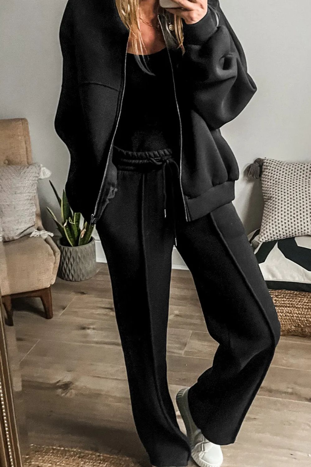 Black seamed jogger pants with drawstring waist and zip-up bomber jacket