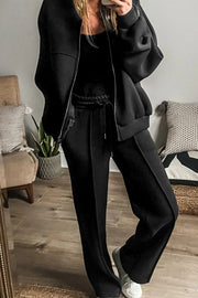 Black seamed jogger pants with drawstring waist and zip-up bomber jacket