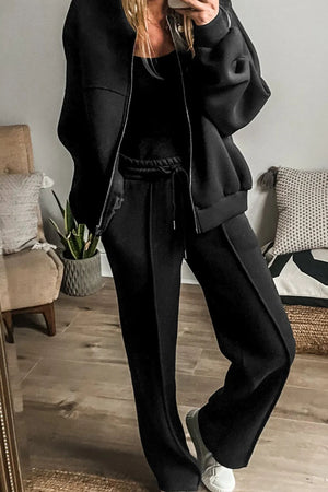Black seamed jogger pants with drawstring waist and zip-up bomber jacket