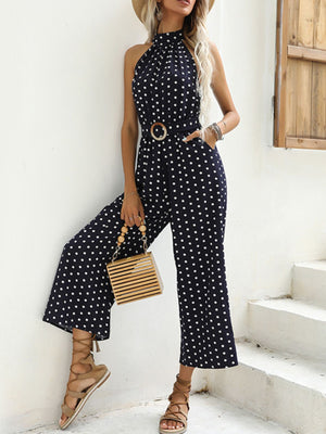 Navy polka dot halter romper with belted waist and wide legs
