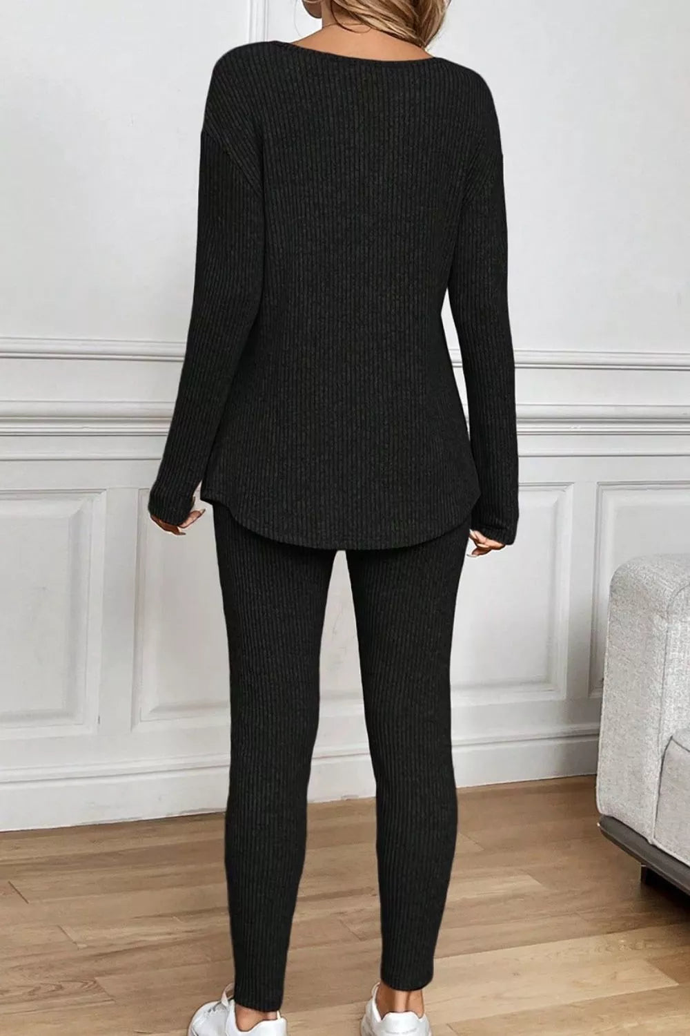 Black ribbed loungewear set with long sleeves and leggings.