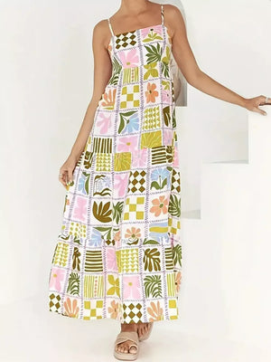 Vibrant patchwork print maxi cami dress with tiered skirt and cutout back detail.