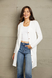 White button-down maxi cardigan with long sleeves and a relaxed fit.